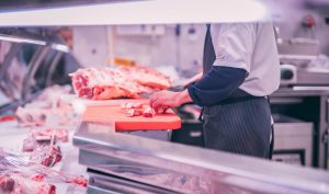 Custom meat cutting, butcher cutting raw meat
